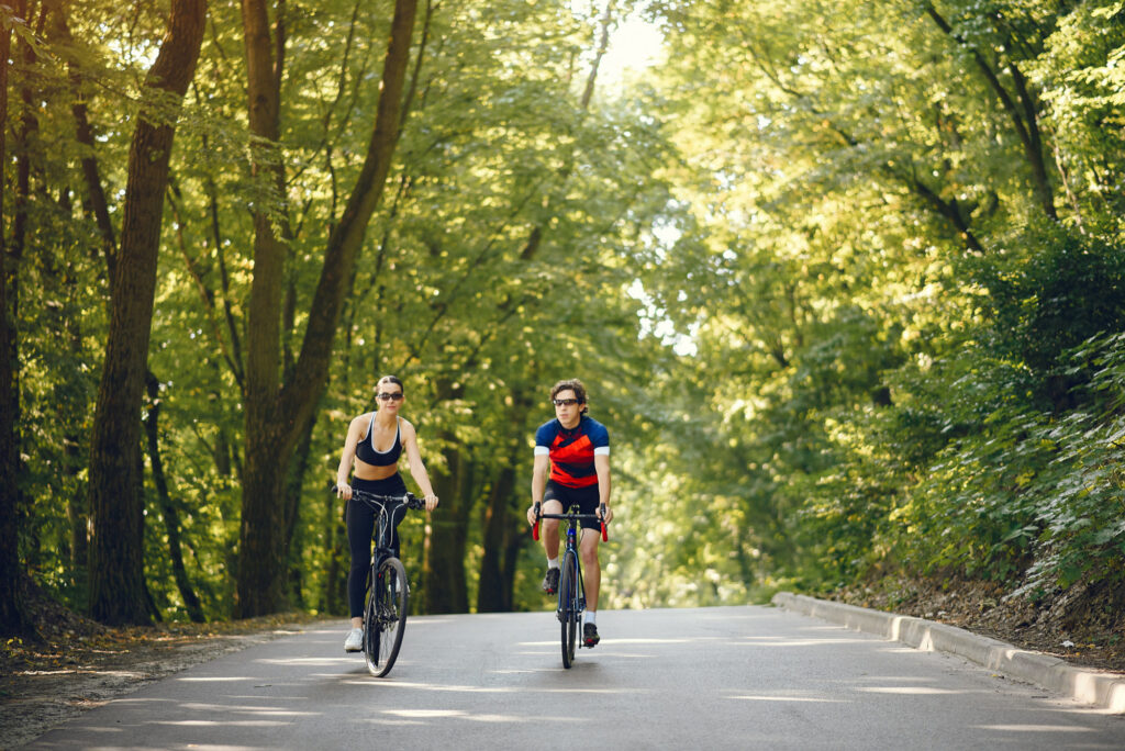Cycling along nature paths in Circeo National Park near Sabaudia surrounded by green forest